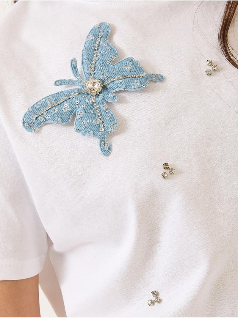 Camiseta de manga corta con accesorios de mariposa y adornos de piedras lucci Blanco - Kiabi