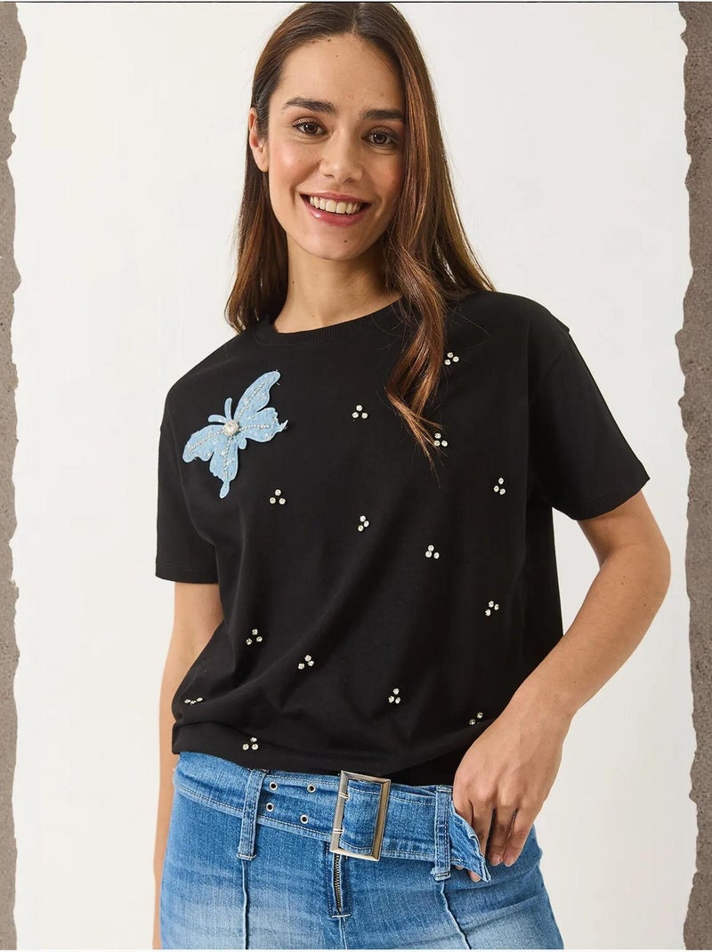 Camiseta de manga corta con accesorios de mariposa y adornos de piedras lucci Negro - Kiabi