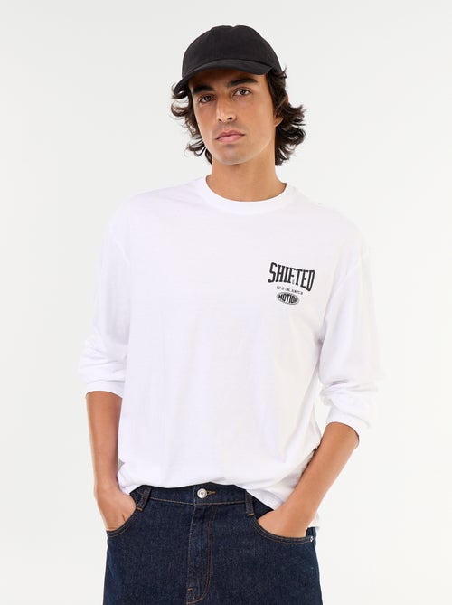 Camiseta de manga larga estampada por delante y por detrás - Kiabi Camiseta de manga larga estampada por delante y por detrás - Kiabi