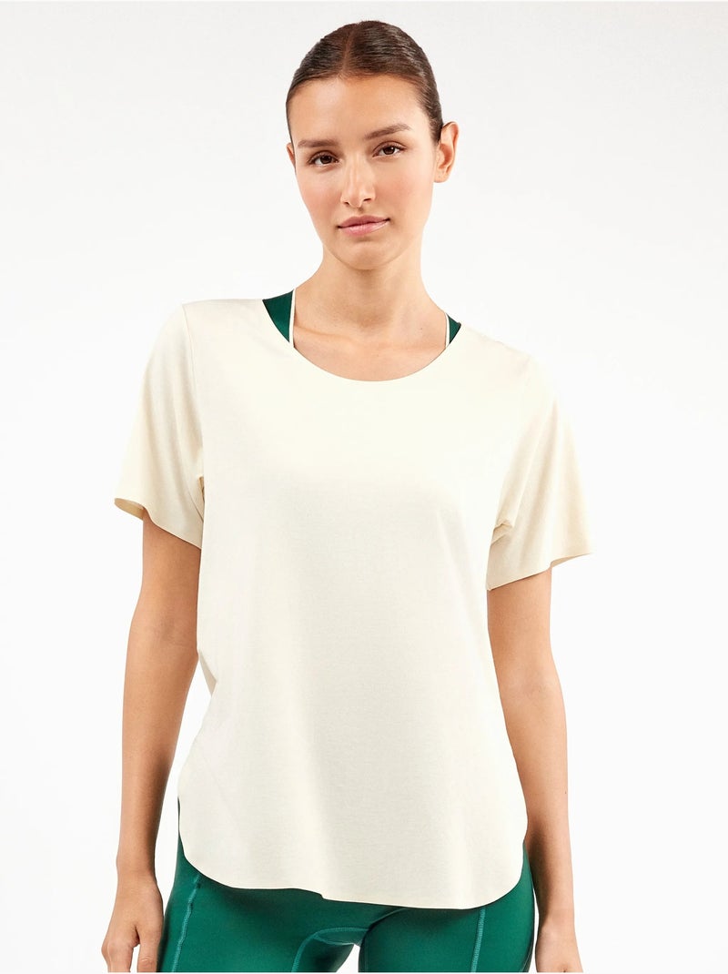 Camiseta deportiva manga corta con aperturas laterales Beige - Kiabi