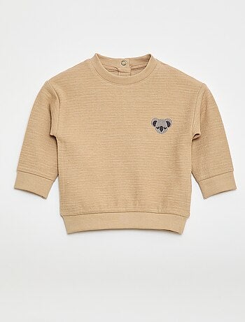 Camiseta gruesa con animal bordado