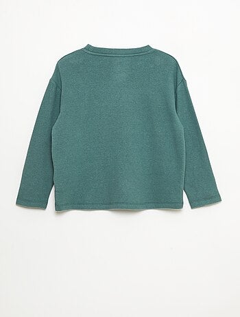 Camiseta corte holgado con diseño en el pecho