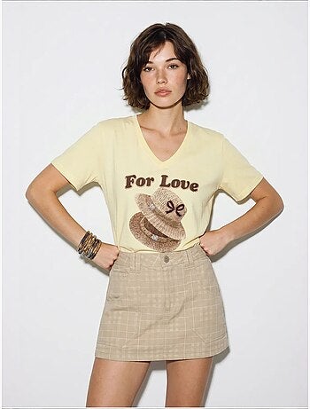 Camiseta oversize con cuello de pico y estampado lucci