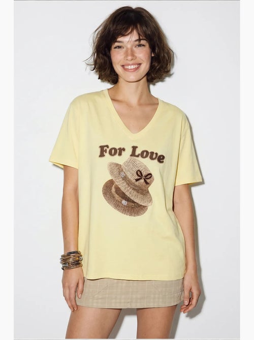 Camiseta oversize con cuello de pico y estampado lucci - Kiabi Camiseta oversize con cuello de pico y estampado lucci - Kiabi