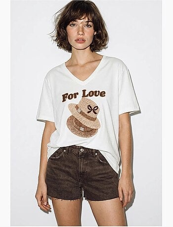 Camiseta oversize con cuello de pico y estampado lucci