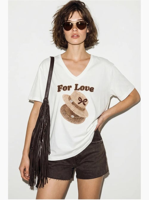 Camiseta oversize con cuello de pico y estampado lucci - Kiabi Camiseta oversize con cuello de pico y estampado lucci - Kiabi