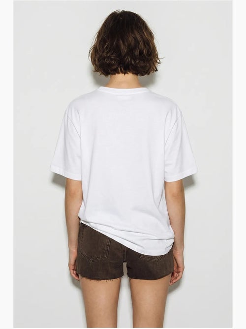 Camiseta oversize con cuello de pico y estampado lucci - Kiabi Camiseta oversize con cuello de pico y estampado lucci - Kiabi
