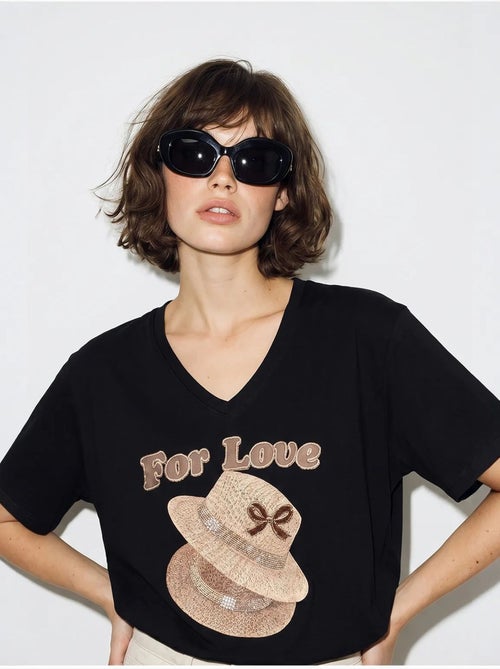 Camiseta oversize con cuello de pico y estampado lucci - Kiabi Camiseta oversize con cuello de pico y estampado lucci - Kiabi