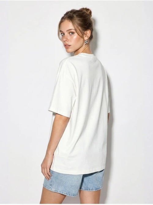 Camiseta oversize de algodón con estrella de lentejuelas lucci - Kiabi Camiseta oversize de algodón con estrella de lentejuelas lucci - Kiabi