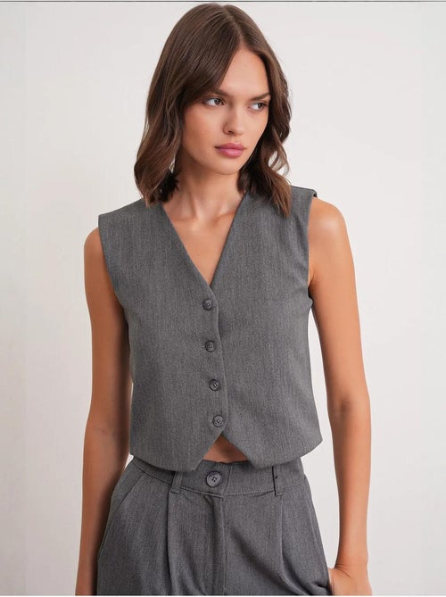 Chaleco abotonado con cuello en v mixray - Kiabi Chaleco abotonado con cuello en v mixray - Kiabi