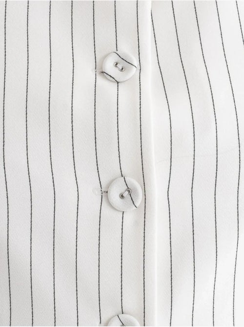Chaleco abotonado con cuello redondo a rayas - Kiabi Chaleco abotonado con cuello redondo a rayas - Kiabi