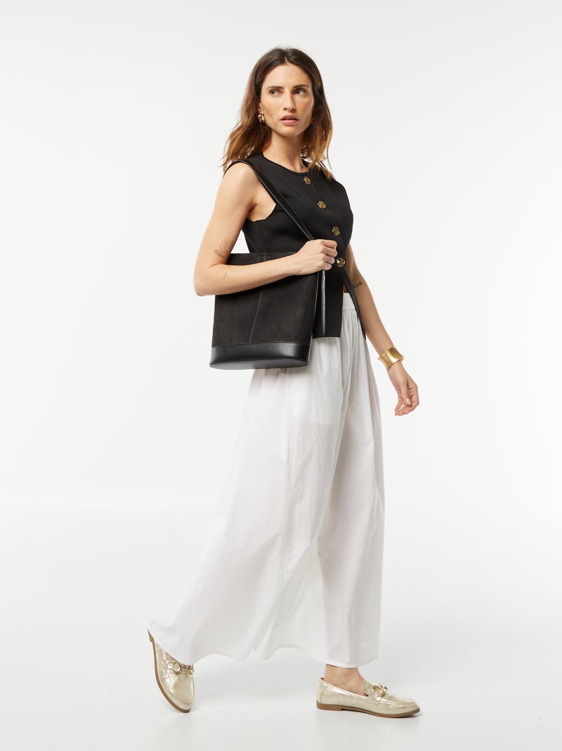 Chaleco con botones dorados negro - Kiabi