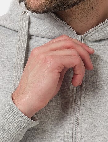 Chaleco con cremallera y capucha