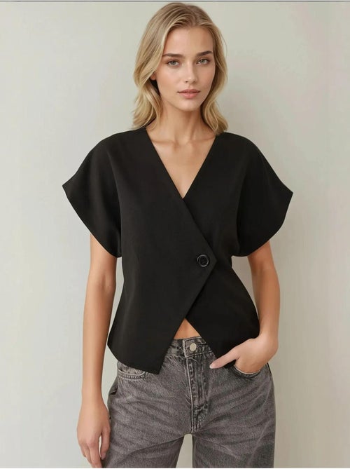 Chaleco con cuello en V y detalle de hombros ajustados - Kiabi Chaleco con cuello en V y detalle de hombros ajustados - Kiabi