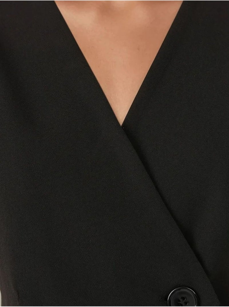 Chaleco con cuello en V y detalle de hombros ajustados Negro - Kiabi