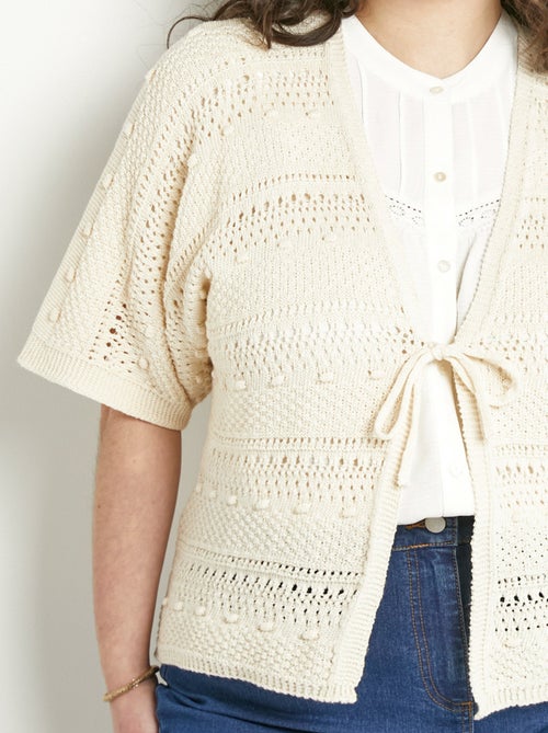 Chaleco corto calado con cuello en V y mangas cortas. - Afibel - Kiabi