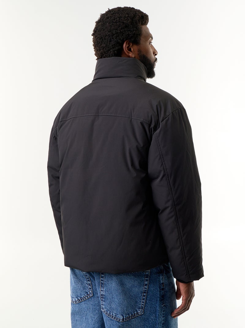 Chaqueta acolchada con cuello alto y mangas raglán Negro - Kiabi