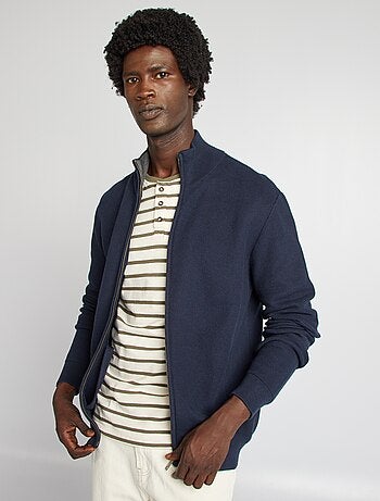 Chaqueta con cremallera cuello alto