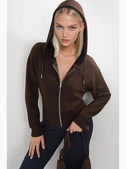 Chaqueta con cremallera y manga larga con capucha busem - Kiabi Chaqueta con cremallera y manga larga con capucha busem - Kiabi