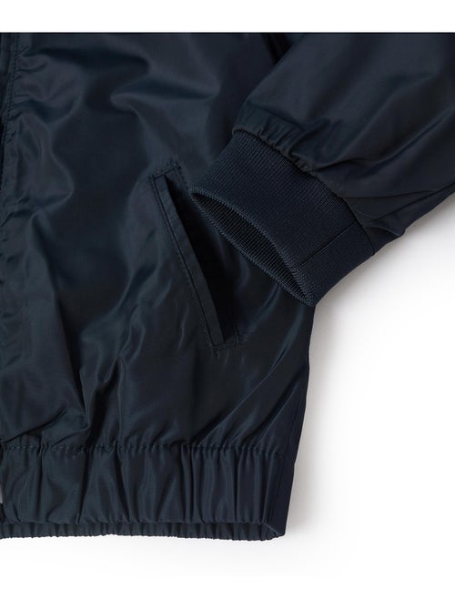 Chaqueta cortavientos con capucha desmontable - Kiabi