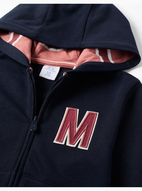 Chaqueta de felpa con capucha y M bordada - Kiabi Chaqueta de felpa con capucha y M bordada - Kiabi