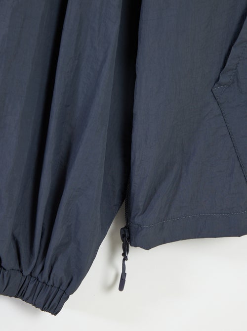 Chaqueta impermeable con capucha - colección fácil de poner - Kiabi