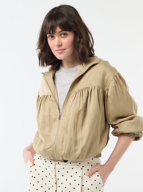 Chaqueta lisa con cremallera y mangas abullonadas - Kiabi