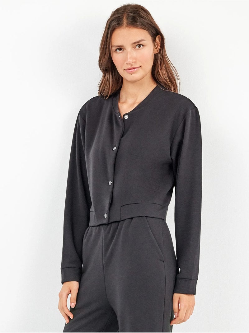 Chaqueta tipo bomber con bolsillos, en tejido de felpa Negro - Kiabi