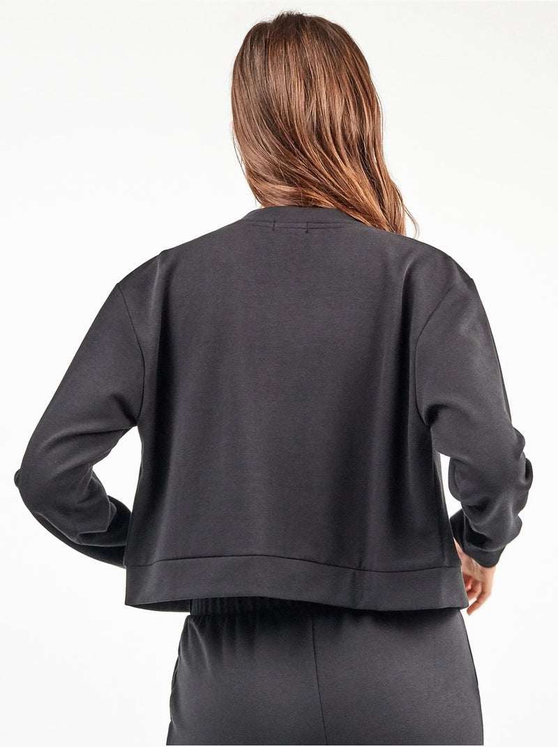Chaqueta tipo bomber con bolsillos, en tejido de felpa Negro - Kiabi