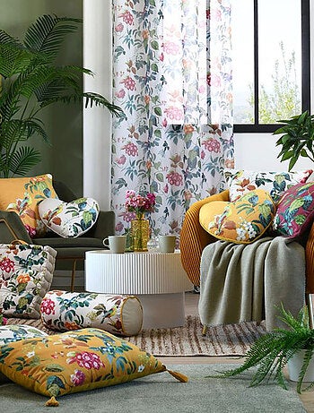 Cojín cilíndrico decorativo con estampado de hojas y pájaro