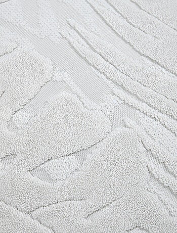 Cojín cuadrado efecto terciopelo con diseño tropical en relieve