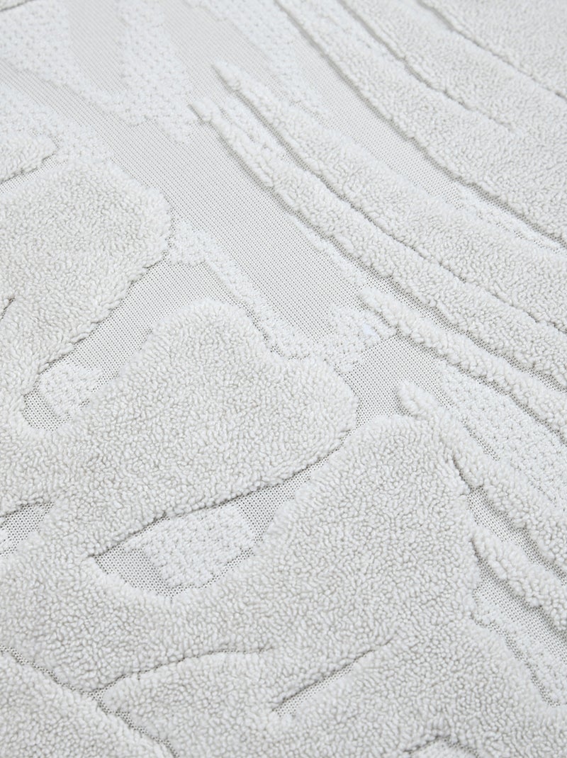Cojín cuadrado efecto terciopelo con diseño tropical en relieve Crudo - Kiabi