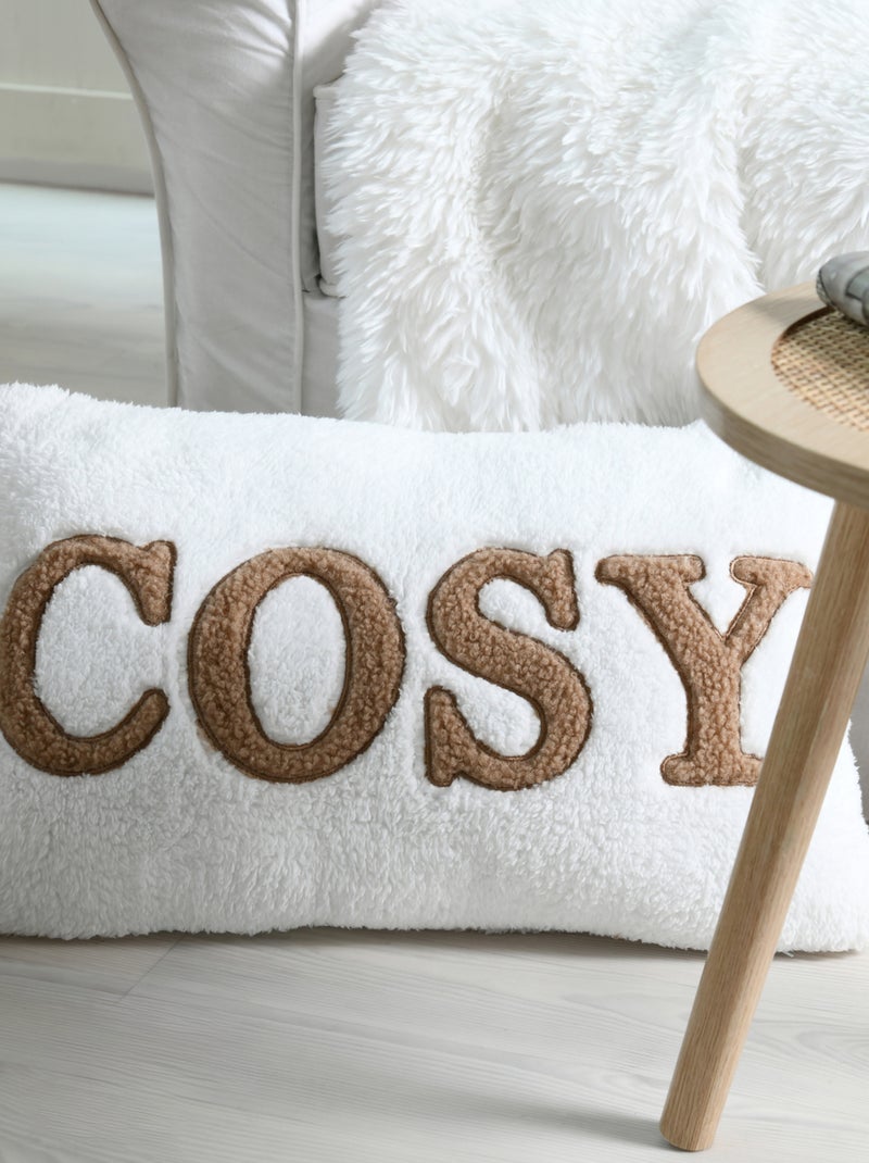 Cojín de forro polar con mensaje bordado "Cosy" Crudo - Kiabi