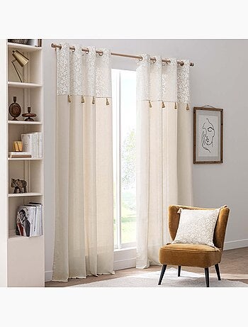 Cojín de polialgodón con estampado floral y borlas