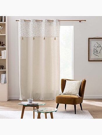 Cojín de polialgodón con estampado floral y borlas