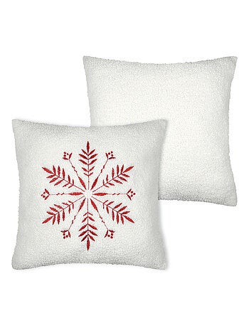 Cojín efecto borreguito con diseño de copo de nieve