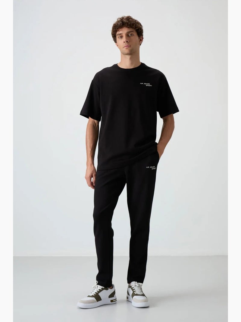 Conjunto active oversize de algodón y poliéster para hombre tommy Negro - Kiabi