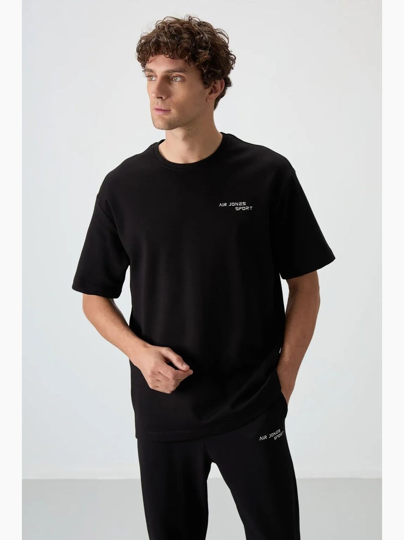 Conjunto active oversize de algodón y poliéster para hombre tommy Negro - Kiabi