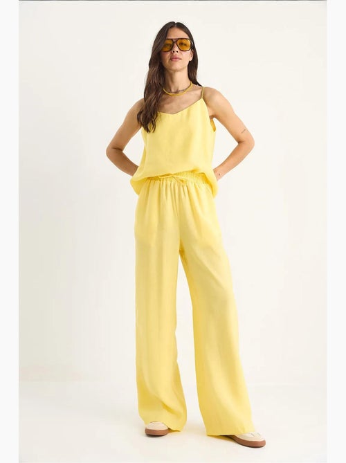 Conjunto coordinado de camisola sin mangas y pantalón de pernera ancha lucci - Kiabi Conjunto coordinado de camisola sin mangas y pantalón de pernera ancha lucci - Kiabi