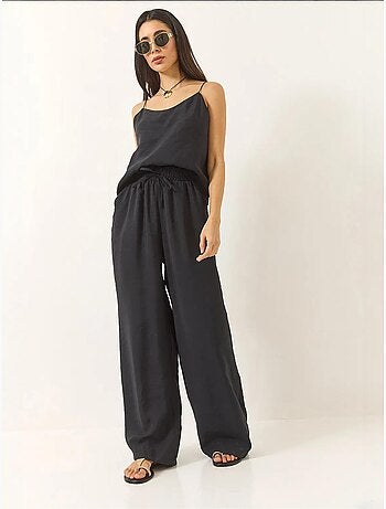 Conjunto coordinado de camisola sin mangas y pantalón de pernera ancha lucci