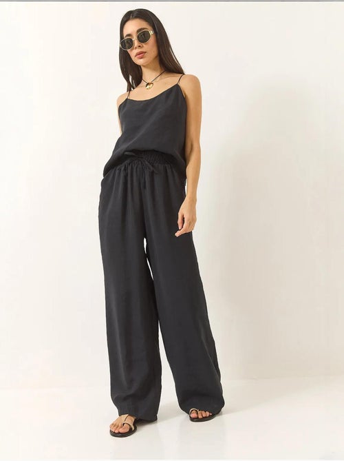 Conjunto coordinado de camisola sin mangas y pantalón de pernera ancha lucci - Kiabi Conjunto coordinado de camisola sin mangas y pantalón de pernera ancha lucci - Kiabi