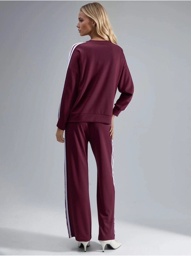 Conjunto coordinado de sudadera a rayas con cuello redondo y pantalón de pernera recta hiccup Rojo burdeos - Kiabi