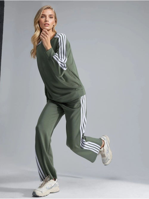 Conjunto coordinado de sudadera a rayas con cuello redondo y pantalón de pernera recta hiccup - Kiabi Conjunto coordinado de sudadera a rayas con cuello redondo y pantalón de pernera recta hiccup - Kiabi