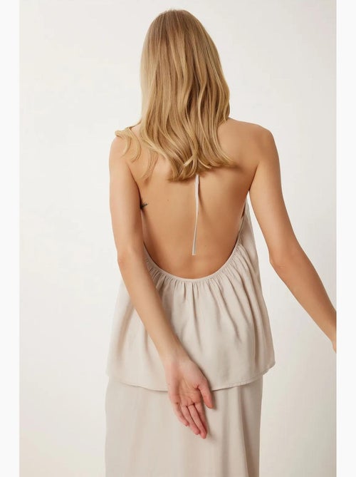 Conjunto de blusa halter con detalle de lazada y falda de pernera ancha istanbul - Kiabi Conjunto de blusa halter con detalle de lazada y falda de pernera ancha istanbul - Kiabi
