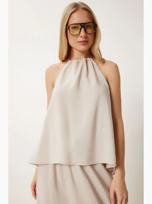 Conjunto de blusa halter con detalle de lazada y falda de pernera ancha istanbul - Kiabi Conjunto de blusa halter con detalle de lazada y falda de pernera ancha istanbul - Kiabi