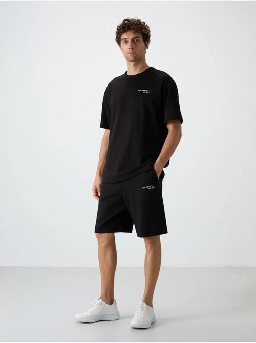 Conjunto de camiseta de manga corta oversize y shorts tommy - Kiabi Conjunto de camiseta de manga corta oversize y shorts tommy - Kiabi