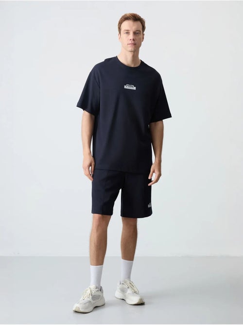 Conjunto de camiseta oversize y shorts para hombre tommy - Kiabi Conjunto de camiseta oversize y shorts para hombre tommy - Kiabi