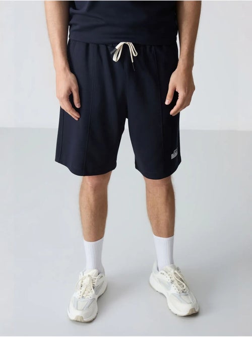 Conjunto de camiseta oversize y shorts para hombre tommy - Kiabi Conjunto de camiseta oversize y shorts para hombre tommy - Kiabi