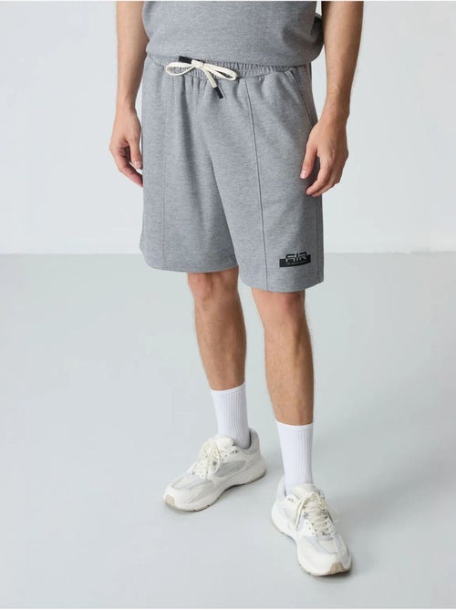 Conjunto de camiseta oversize y shorts para hombre tommy - Kiabi Conjunto de camiseta oversize y shorts para hombre tommy - Kiabi