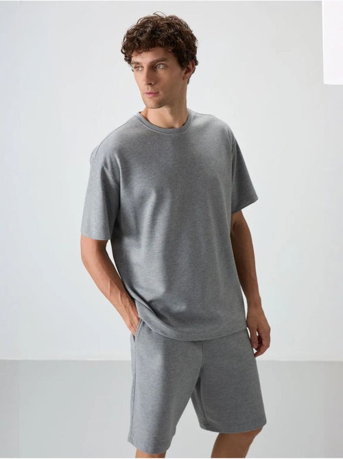 Conjunto de camiseta oversize y shorts tommy - Kiabi Conjunto de camiseta oversize y shorts tommy - Kiabi